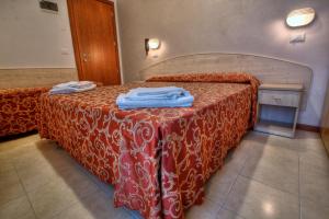 Postel nebo postele na pokoji v ubytování Hotel Belmar