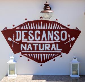 a sign for aresos natal hanging on a wall at Descanso Natural Bueu in Bueu