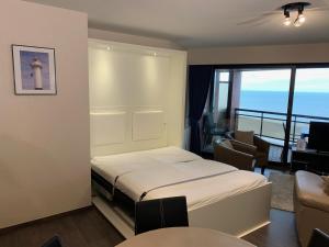 
A bed or beds in a room at Studio with Seaview
