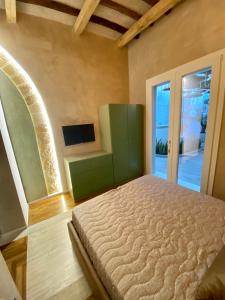 Postel nebo postele na pokoji v ubytování Il cortile di Elen