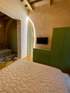 Postel nebo postele na pokoji v ubytování Il cortile di Elen
