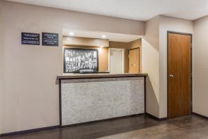 a hotel lobby with a reception counter and a door at Super 8 by Wyndham Arcata in Arcata