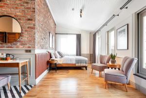 a bedroom with a bed and a brick wall at World House Boutique Hotel Galata in Istanbul