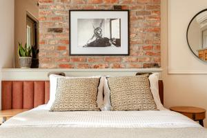 a bedroom with a brick wall and a bed at World House Boutique Hotel Galata in Istanbul