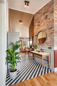 a living room with a table and a brick wall at World House Boutique Hotel Galata in Istanbul