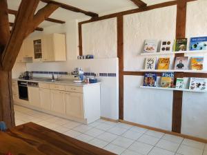 a kitchen with a sink and a counter top at Apartment Altes Pfarrhaus in Plau am See in Plau am See
