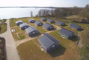 an aerial view of a row of houses next to the water at Witt am See F in Klein Wittensee