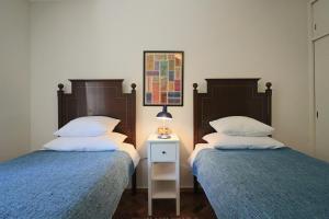 Кровать или кровати в номере Apartamento de charme