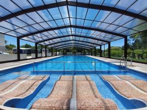 The swimming pool at or close to Hotel Arco Iris
