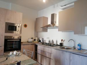 Kuchyňa alebo kuchynka v ubytovaní Residence Edera