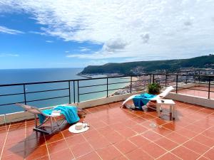 a balcony with a view of the ocean at Sea View Apartment Sesimbra- Apartamento Vista Mar in Sesimbra