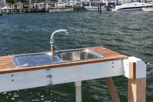 a kitchen sink on a dock in the water at The Moorings at Metung in Metung