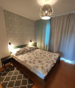 Кровать или кровати в номере Dom Zielony Ogrod