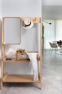a mirror on a shelf in a room at Beach Apartments in Haifa
