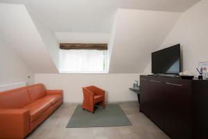 Televiisor ja/või meelelahutuskeskus majutusasutuses Apartments Trio