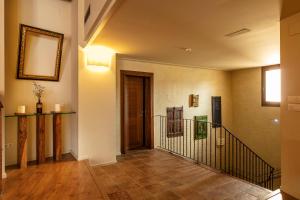 a hallway of a home with a spiral staircase at Cal Compte Priorat in Torroja