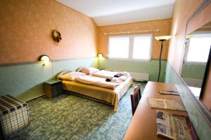 Posteľ alebo postele v izbe v ubytovaní Piknik Wellness Hotel