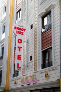 a hotel sign on the side of a building at Ersoy İkiz Otel in Antalya