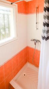 a bathroom with a bath tub with a window at Orangeraie du Cap d'Antibes in Antibes +10 photos