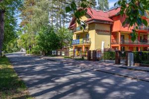 an empty street in front of a house at Panorama in Pobierowo