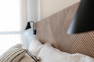 Łóżko lub łóżka w pokoju w obiekcie Malagaroom Victoria 43