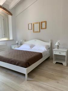 Postel nebo postele na pokoji v ubytování B&B Nonna Teresa