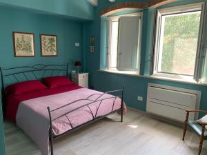 Postel nebo postele na pokoji v ubytování B&B Nonna Teresa