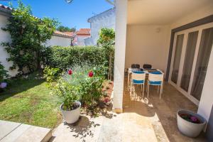 Vonkajšia záhrada v ubytovaní Apartment Rosse