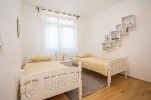 Posteľ alebo postele v izbe v ubytovaní Apartment Rosse