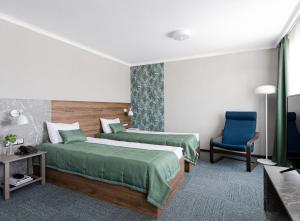 Cama o camas de una habitación en Chelyabinsk Hotel 4 floor