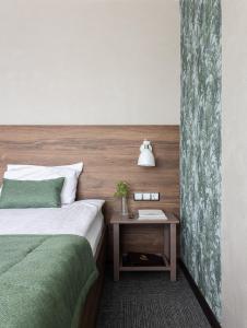 Ein Bett oder Betten in einem Zimmer der Unterkunft Chelyabinsk Hotel 4 floor