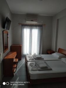 Postel nebo postele na pokoji v ubytování GR Apartments Sea View