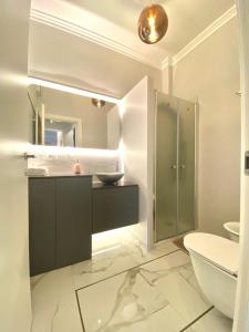a bathroom with a sink and a toilet and a mirror at ABCdecor Italia in Imperia +48 photos
