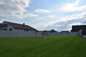 a soccer field with a goal in the grass at Chalupa Rekreant in Bešeňová