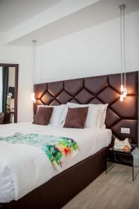 Postel nebo postele na pokoji v ubytování Sanremo Luxury Suites