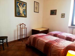 En eller flere senge i et værelse på La casa di Giosuè