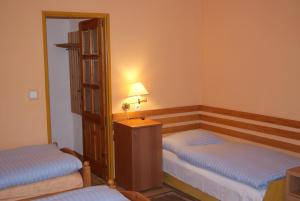 Łóżko lub łóżka w pokoju w obiekcie Hotel Alga