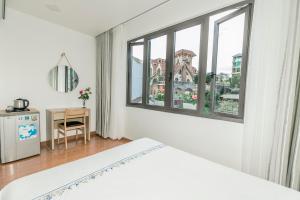 Postel nebo postele na pokoji v ubytování Hotel Pansy