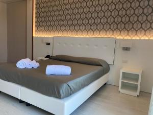 Postel nebo postele na pokoji v ubytování Hotel Biancamano