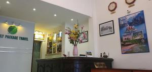 a room with a vase of flowers on a counter at WIN HOTEL in Hanoi