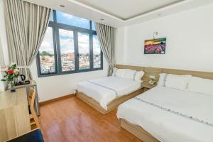 Postel nebo postele na pokoji v ubytování Hotel Pansy