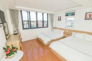 Postel nebo postele na pokoji v ubytování Hotel Pansy