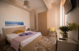 Кровать или кровати в номере Sale e Sabbia