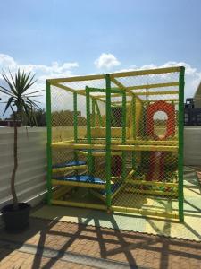 a cage on the side of a building at Lavender Villa in Mamaia Sat/Năvodari