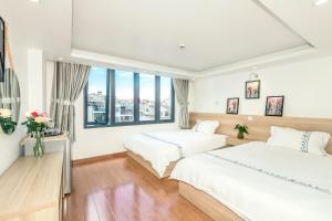 Postel nebo postele na pokoji v ubytování Hotel Pansy