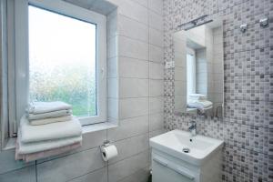 Ein Badezimmer in der Unterkunft Apartments Volarevic