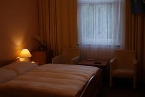 Łóżko lub łóżka w pokoju w obiekcie Hotel Alga