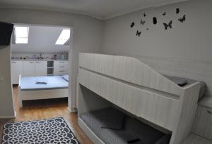 a childs room with a staircase with bats on the wall at Black Valley House in Gura Humorului