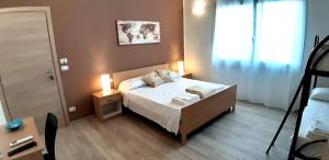 a small bedroom with a bed and a window at B&B Filieri in Santa Maria al Bagno +26 photos