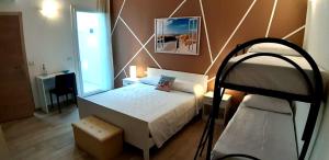 a bedroom with a bed and a bunk bed at B&B Filieri in Santa Maria al Bagno